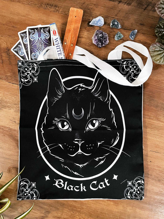 Pictured is a large canvas tote bag featuring an image of a black cat. Black Cat Tote Bag