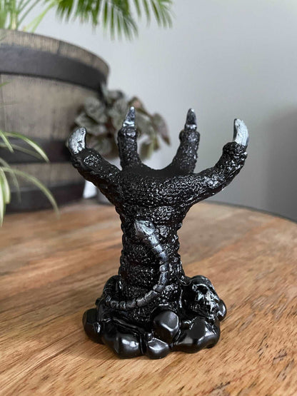 Pictured is a sphere stand in the shape of a black dragon's claw. Dragon Claw Crystal Sphere Stand - The Wandering Fox Emporium, Your Metaphysical Store front 2