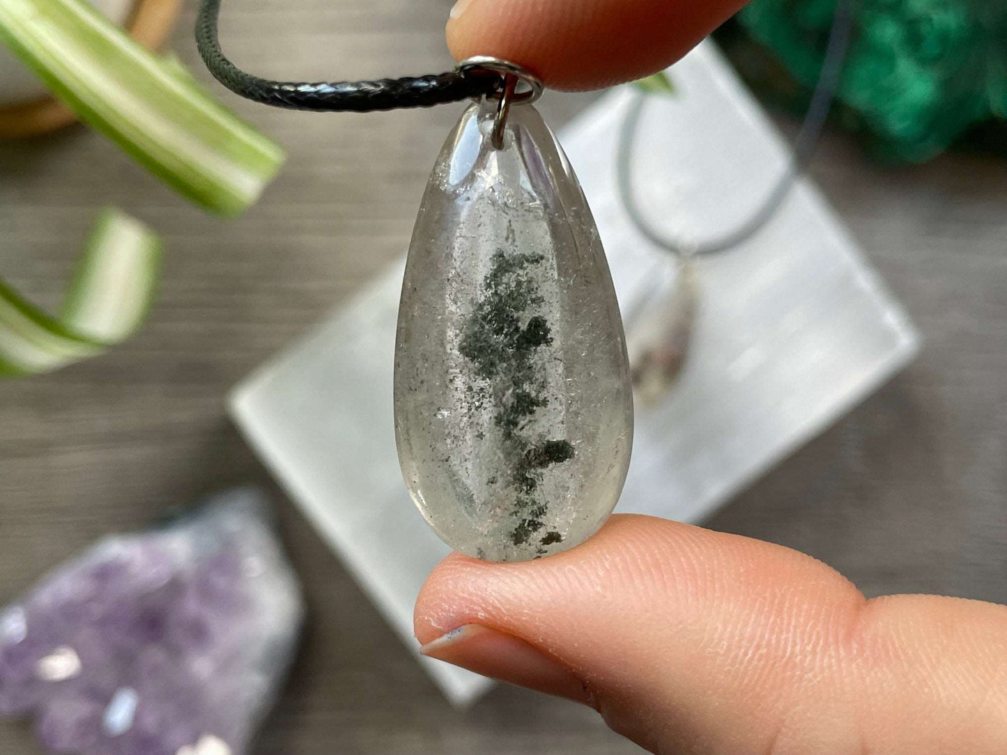 Pictured are various garden Garden Quartz Pendant Necklace Crystal ateardrop necklaces.