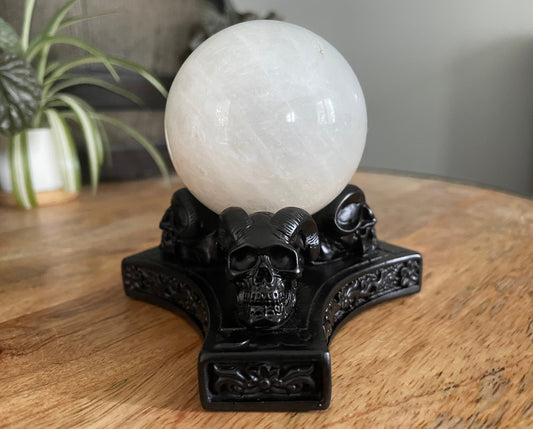 Pictured is a sphere stand in the shape of three demon skulls. Triple Demon Skull Crystal Sphere Stand front