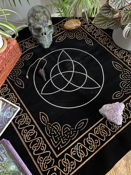 Pictured is a black velvet altar cloth with a silver triquetra in the middle. Triquetra Altar Cloth