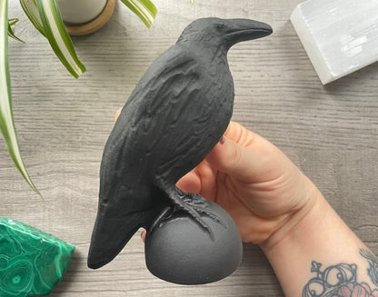 Pictured is a raven carved out of black obsidian.