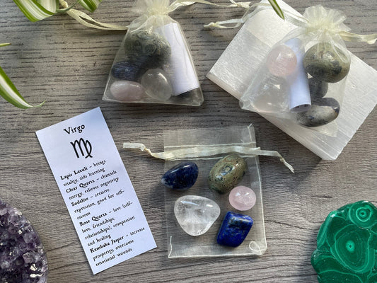 An image of a collection of tumbled stones in an organza bag. To the side is a piece of paper that describes what each tumbled stone's metaphysical properties are. VIRGO Zodiac Tumbled Crystal Bag 