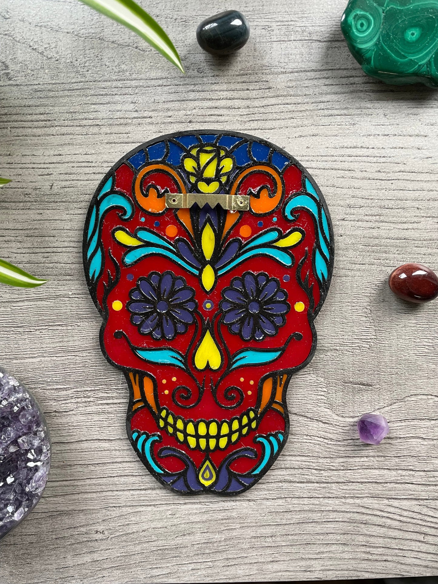 Pictured is a faux stained glass sugar skull made out of wood and acrylic. Sugar Skull Wall Art (Red) back