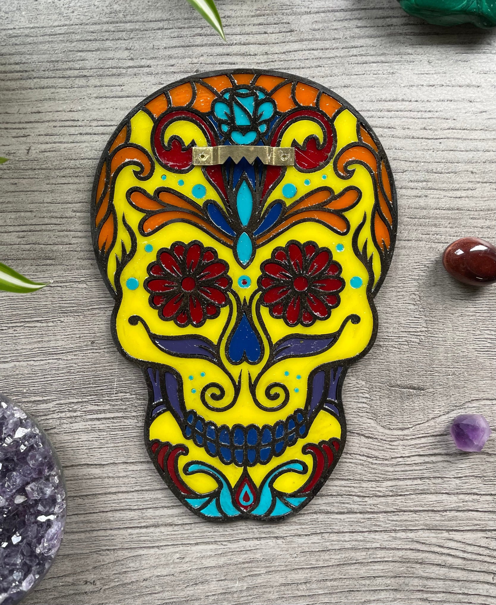 Pictured is a faux stained glass sugar skull made out of wood and acrylic. Sugar Skull Wall Art (Yellow) back