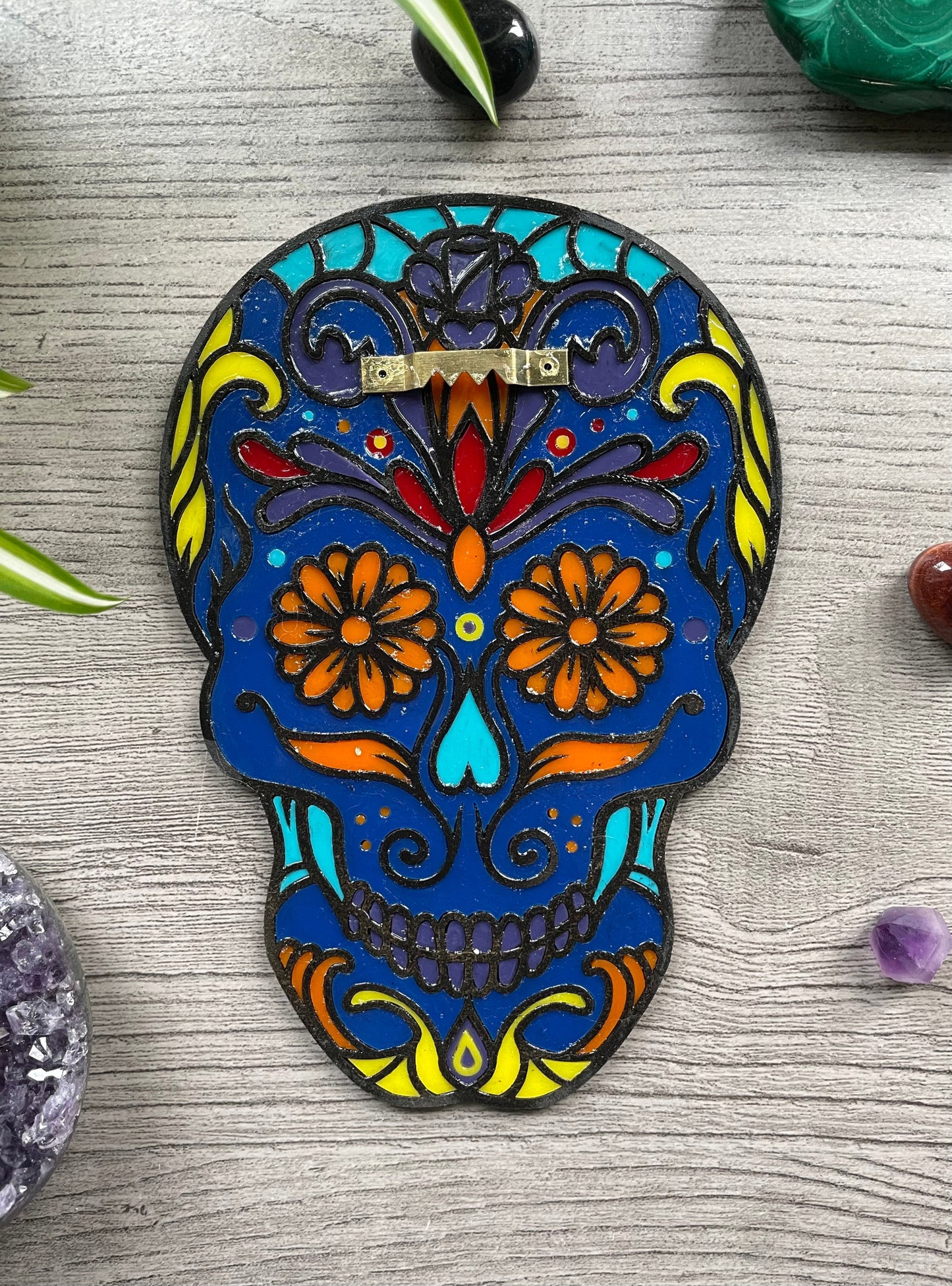 Pictured is a faux stained glass sugar skull made out of wood and acrylic. Sugar Skull Wall Art (Blue) back