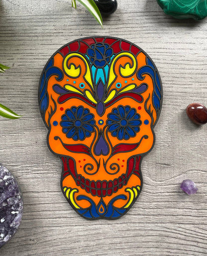 Pictured is a faux stained glass sugar skull made out of wood and acrylic. Sugar Skull Wall Art (Orange) front