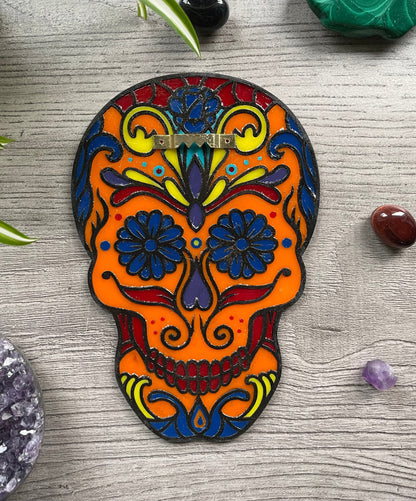 Pictured is a faux stained glass sugar skull made out of wood and acrylic. Sugar Skull Wall Art (Orange) back