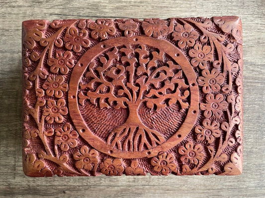 Pictured is hand-carved wood box with a tree of life in the middle. Tree of Life Large Carved Wooden Box