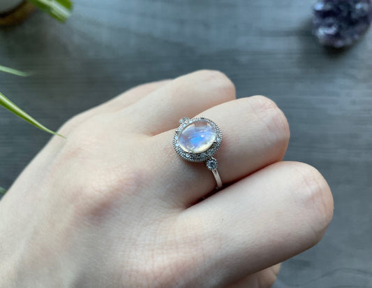 Pictured is a white moonstone gemstone set in an S925 sterling silver ring. White Moonstone S925 Sterling Silver Ring (F) - The Wandering Fox Emporium, Your Crystal Store side