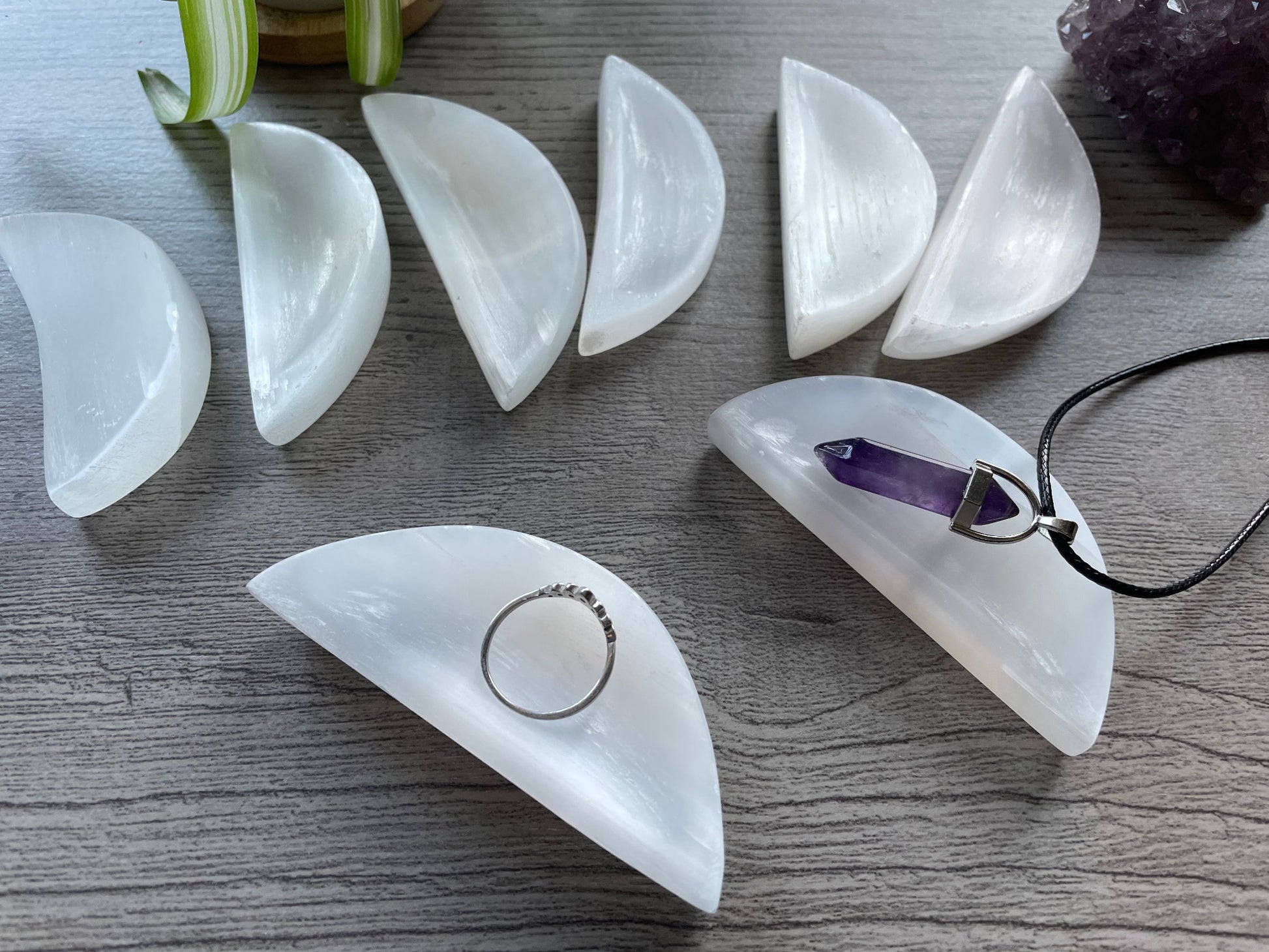 Pictured is a crescent-shaped bowl carved out of selenite. Mini Selenite (Satin Spar) Crystal Moon Bowls 