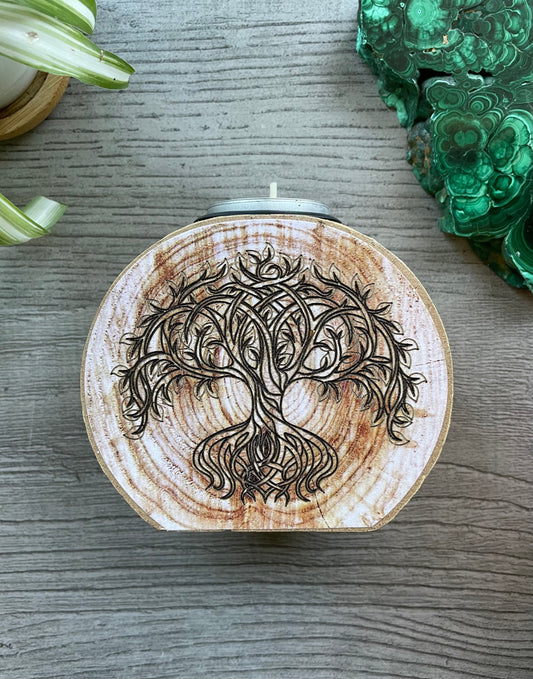 Pictured is a wood tree slice candle holder with a tree of life envraged on it. Tree of Life Engraved Wooden Candle Holder front