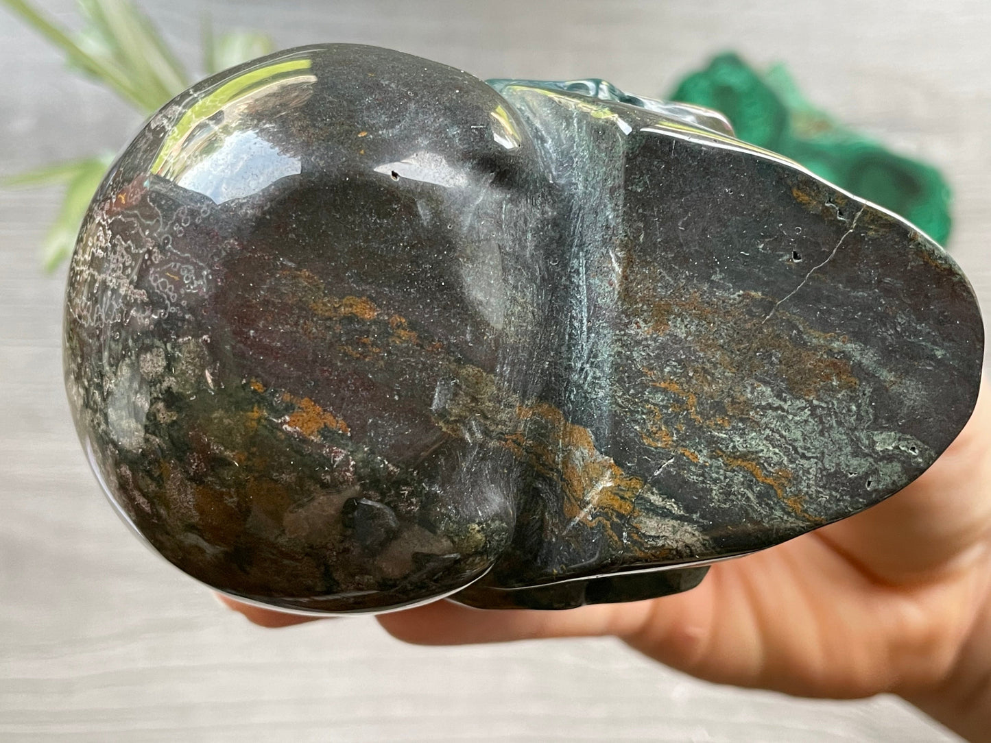 Pictured is a large skull carved out of ocean jasper or river jasper. Ocean Jasper Crystal Skull .65kg - The Wandering Fox Emporium, Your Metaphysical Store bottom