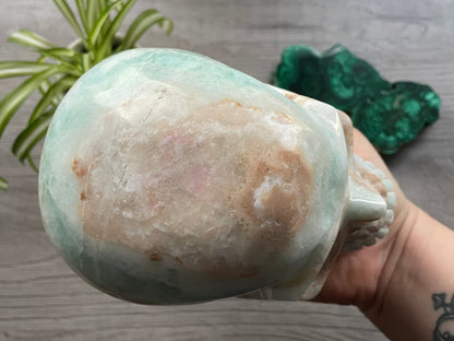 Pictured is a large skull carved out of Caribbean Calcite (blue calcite and white and brown aragonite). HUGE Caribbean Calcite Crystal Skull (2.35kg) - The Wandering Fox Emporium, Your Crystal Store top