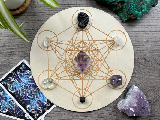 Pictured is a wood crystal grid board. Wood Metatron's Cube Crystal Grid