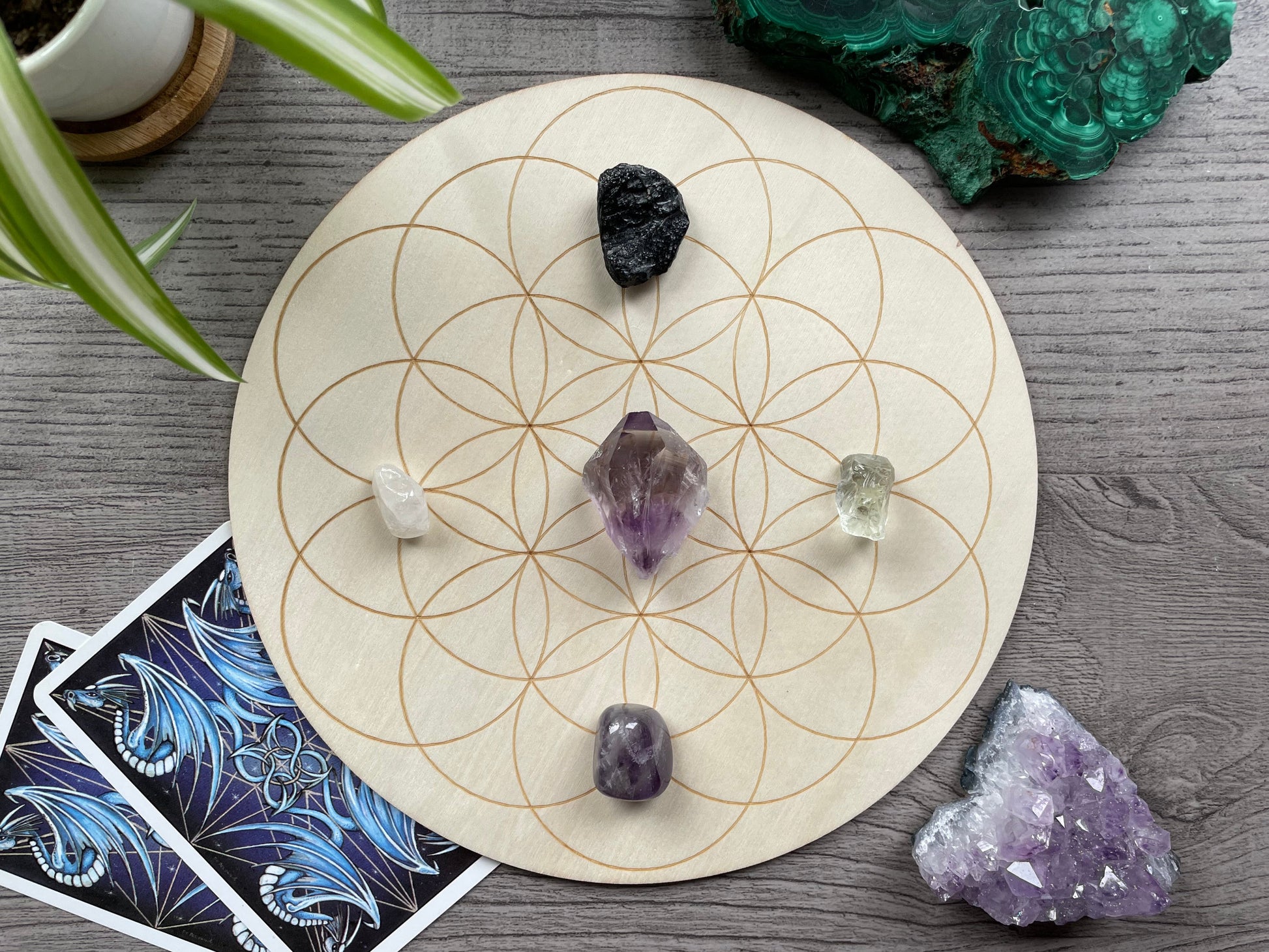 Pictured is a wood crystal grid board. Wood Seed of Life Crystal Grid 20cm