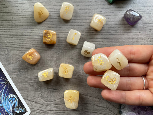 Pictured are reiki symbol stones carved out of golden healer tumbled crystals. Reiki Golden Healer Symbol Stones