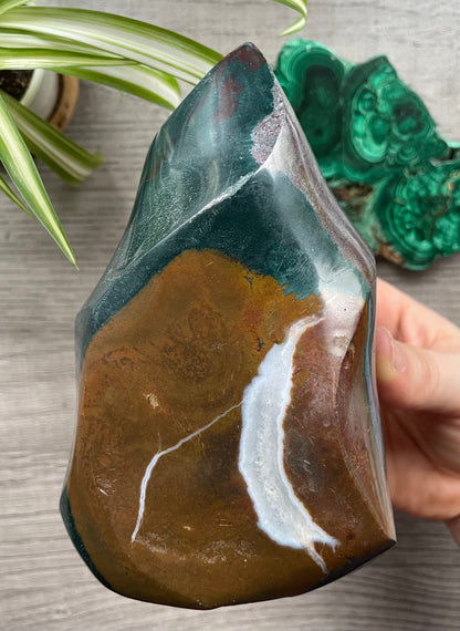 Pictured is a carved ocean jasper (river jasper) flame. Ocean Jasper Flame 1.1kg - The Wandering Fox Emporium, Your Crystal Store back