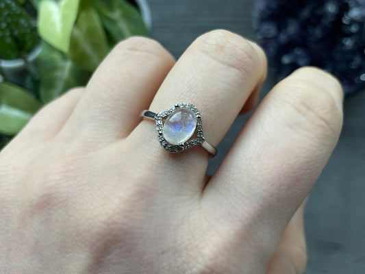 Pictured is a white moonstone gemstone set in an S925 sterling silver ring. White Moonstone S925 Sterling Silver Ring (H) - The Wandering Fox Emporium, Your Crystal Store