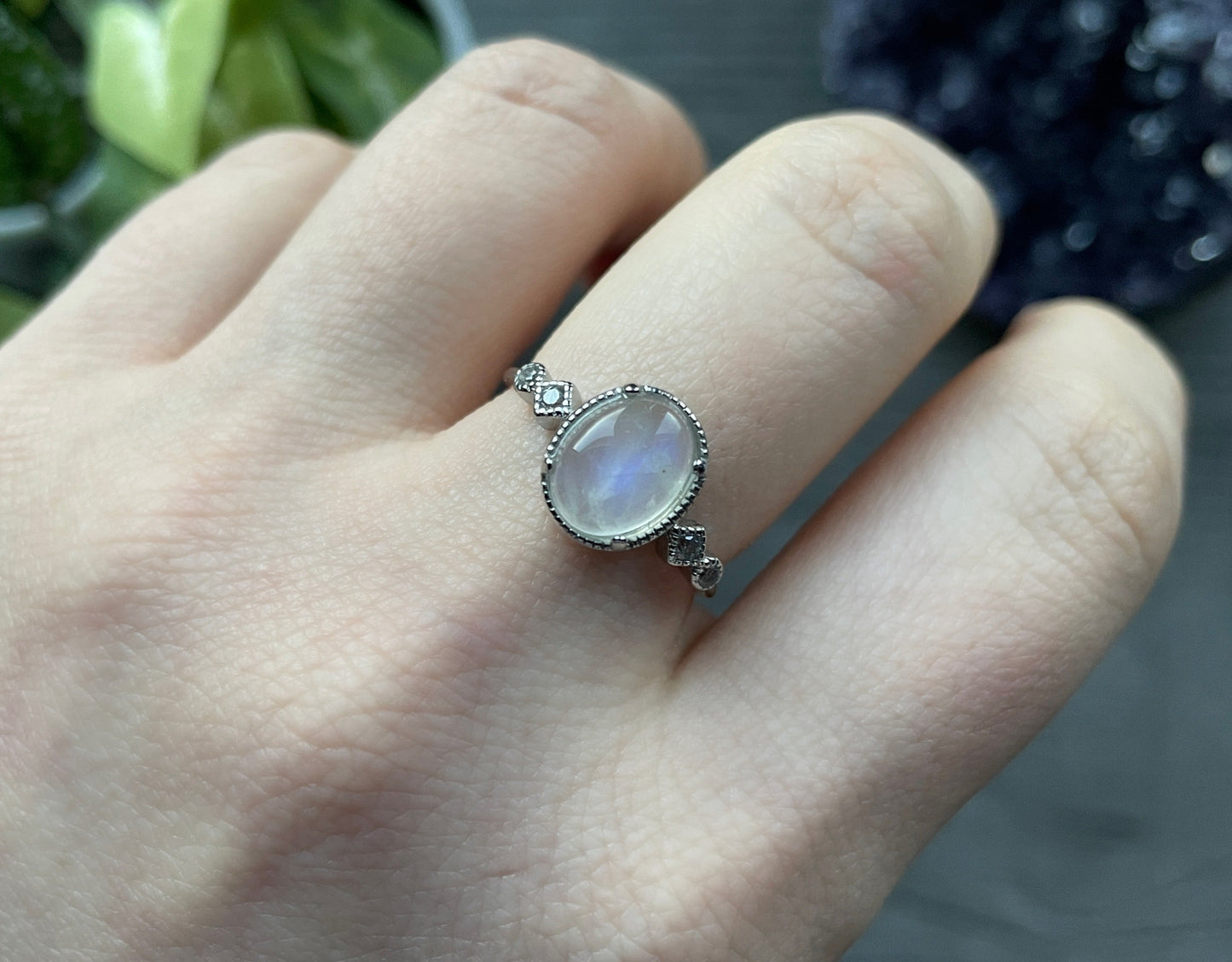 Pictured is a white moonstone gemstone set in an S925 sterling silver ring. White Moonstone S925 Sterling Silver Ring (Style 2 - D) - The Wandering Fox Emporium, Your Crystal Store close up