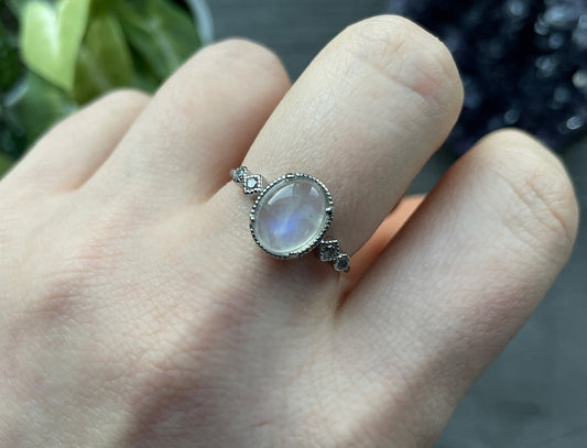 Pictured is a white moonstone gemstone set in an S925 sterling silver ring. White Moonstone S925 Sterling Silver Ring (Style 2 - D) - The Wandering Fox Emporium, Your Crystal Store