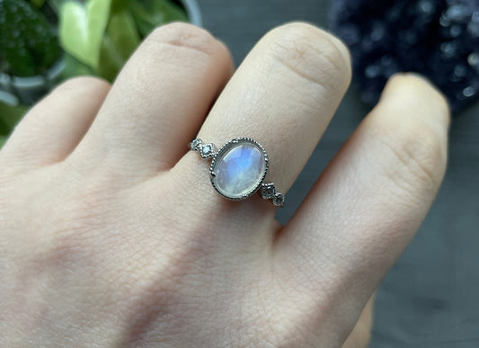 Pictured is a white moonstone gemstone set in an S925 sterling silver ring. White Moonstone S925 Sterling Silver Ring (Style 2 - A) - The Wandering Fox Emporium, Your Crystal Store